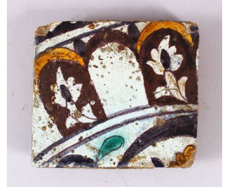 A 17TH CENTURY NORTH AFRICAN TILE, 15.5cm x 14cm.