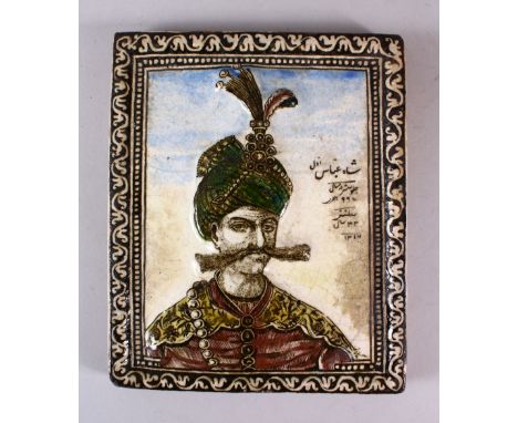 A 19TH CENTURY PERSIAN QAJAR MOULDED POTTERY TILE depicting Shah Abbas, dated 1317/1899 ad, 25cm x 21cm.
