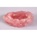 A CHINESE CARVE ROSE QUARTZ DRAGON DISH, carved with scenes of two creeping dragons to the side,