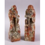 A PAIR OF CHINESE CARVED SOAPSTONE FIGURES OF DEMONS, each demon depicted upon a rocky outcrop