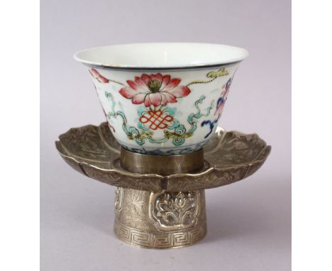 A 19TH CENTURY CHINESE FAMILLE ROSE RICE PATTERN PORCELAIN RICE BOWL &amp; WHITE METAL STAND, the body of the bowl with buddh