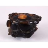 A CHINESE CARVED DARK CRYSTAL / QUARTZ FLORAL POT & COVER, the body carved with flora and stood upon