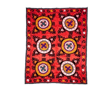 A SUZANI PANEL  Red ground, possibly on a satin field  210cm x 168cm   Condition Report:  Creasing, fold marks, as per age, h
