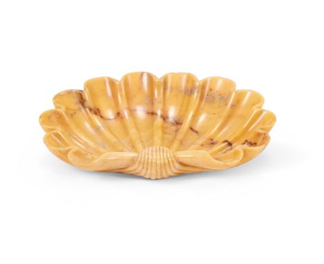 AFTER THE ANTIQUE- A CARVED GIALLO ANTICO SHELL  ITALIAN LATE 19TH/EARLY 20TH CENTURY   13.3cm wide, 10cm high    Condition R