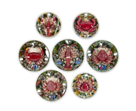 A GROUP OF SEVEN SIMILAR CALDAS DA RAINHA MAIOLICA PLATES IN BERNARD PALISSY STYLE  PORTUGAL, VARIOUS DATES 20TH CENTURY Natu