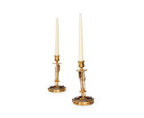 AN UNUSUAL PAIR OF GILT BRONZE AND SILVERED 'MARTIAL' CANDLESTICKS  BY ANTONIO IUDICE, DATED 2018 Stems with mounts of long a