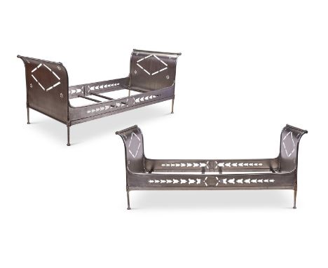 A PAIR OF EMPIRE STEEL SINGLE BEDS  CIRCA 1800  With pierced ends and side rails- probably later, one side rail stamped FD  8