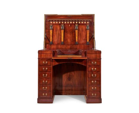 AN EMPIRE BRONZE MOUNTED, PARCEL GILT, AMBOYNA AND INLAID MAHOGANY DESK  CIRCA 1810  With a mechanical counter weight mechani