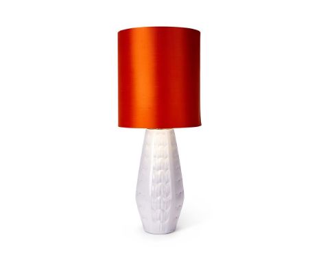 A LARGE BAVARIAN WHITE LAMP BASE  1960s  Glazed ceramic with stylised leaf design, orange lampshade, base inscribed '1010/53'