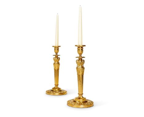 A VERY NEAR PAIR OF FRENCH GILT AND PATINATED BRONZE CANDLESTICKS AFTER GALLE AND PERCIER  MID 19TH CENTURY  Characteristic f