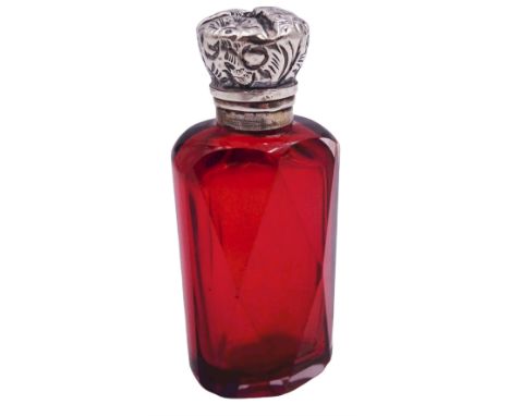 Victorian silver mounted scent bottle, the faceted ruby glass body with silver mounted foliate embossed hinged cover, opening