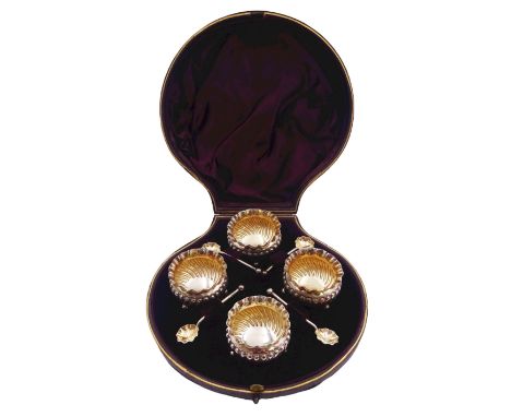 Set of four Victorian silver open salts, each of circular part fluted form with crimped rim, upon three ball feet, and four c