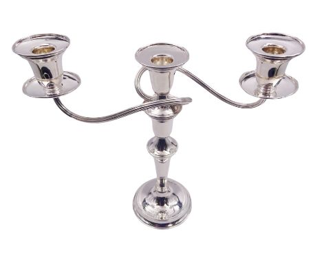 Modern silver twin branch candelabra, the filled circular base with personal engraving leading to a tapering stem supporting 