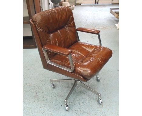 REVOLVING OFFICE CHAIR, vintage Italian buttoned tan leather revolving on an adjustable metal base with castors by 'Vashi'. 