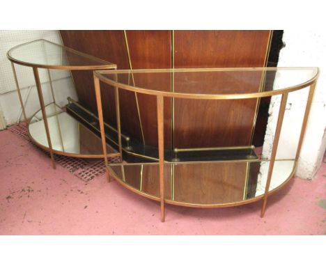 DEMI LUNE CONSOLE TABLES, a pair, gilt metal framed with glass tops and mirrored undertiers, 76cm H x 127cm x 43cm. (2)