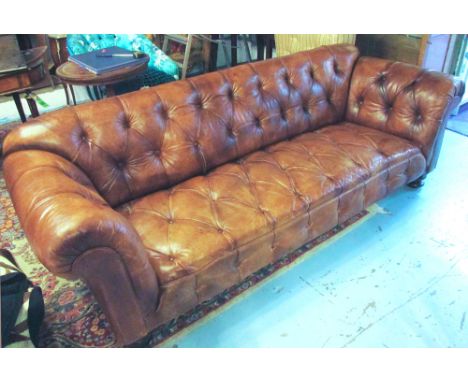 CHESTERFIELD SOFA, with buttoned tan leather upholstery on bun feet, 238cm L x 76cm H. (with faults) 