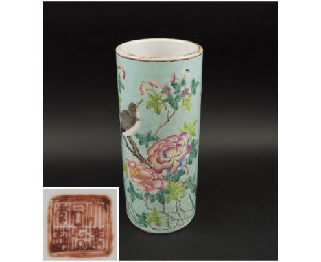 BRUSH POT, Chinese ceramic of cylindrical form decorated flowering prunus branches on a pale green ground, 28.5cm H.