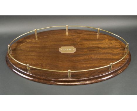 DECANTER TRAY, Victorian manner, polished wood with brass gallery, 60cm L x 37cm W x 6cm H maximum. 