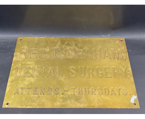 A brass name plaque for 'Reg. C. Graham Dental Surgery', 18 x 12".