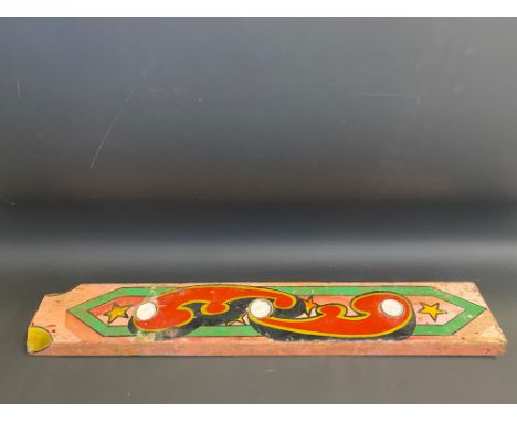 A hand painted wooden fairground panel, with later inset night light candles, 34 1/2 x 6".