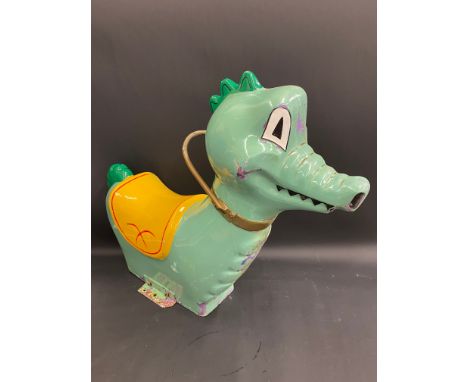 An original 1950s fairground juvenile ride with original brackets, in the form of 'Puff the magic dragon'.