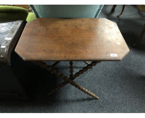 An early twentieth century folding table on bobbin legs 