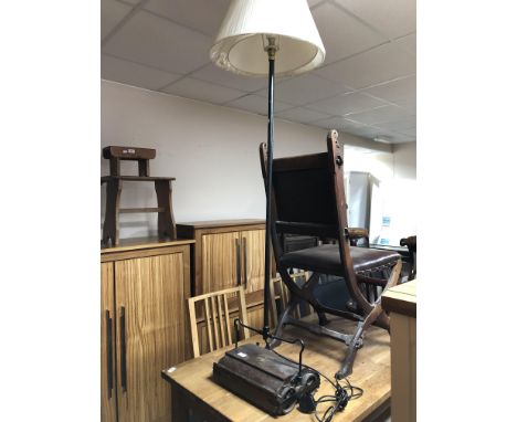 A vintage Ewbank Success carpet sweeper converted to a floor lamp 