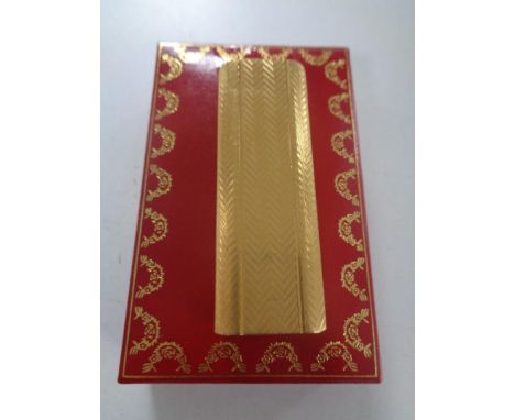 A Cartier lighter, 729 14K gold plated, in original box.  