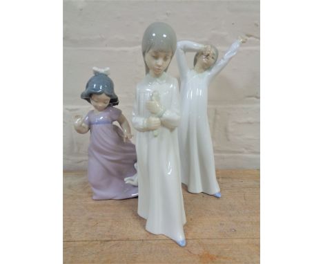 Three Nao figures, girl with puppy, together with two further figures, children in nightdress.  