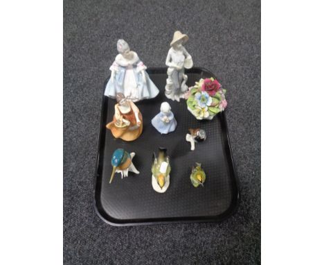 A tray containing china figurines to include Royal Doulton Southern Belle HN2425, Francesca Art China figure Mary, Goebel bir