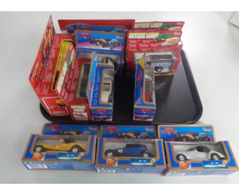 A tray containing thirteen boxed die cast vehicles to include Old Timer and antique lorry delivery vans and classic cars.   