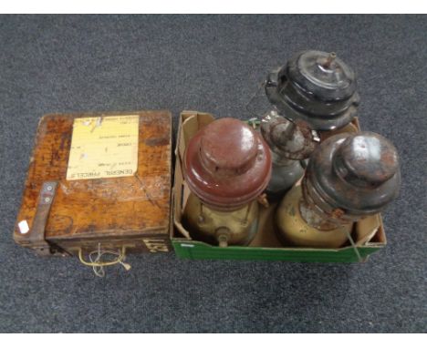 Three vintage Tilley and Coleman lamps together with a wooden railway ticket machine case.  