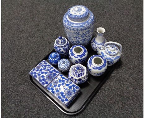 A tray containing blue and white oriental style lidded vases, ginger jars, trinket boxes, teapot etc. 