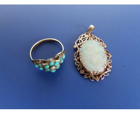 A small old turquoise set gold cluster ring and a damaged opal pendant, 1.1" overall height. (2)