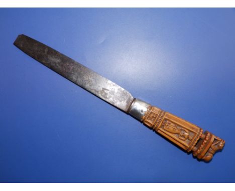A 17thC knife, the carved wooden handle having a finial with lion holding a shield with cross, the sides depicting women hold