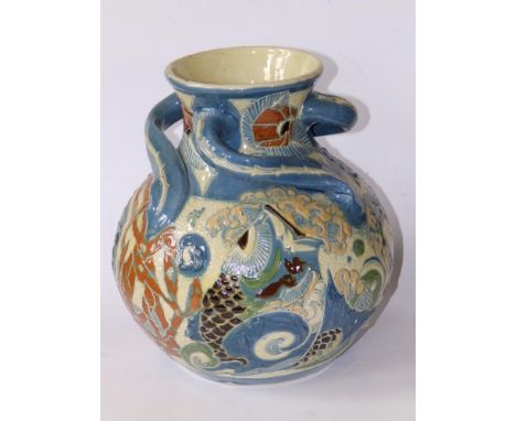 An early 20thC Brannam pottery three-handled vase, decorated with fish &amp; seaweed in colours -  incised 'C.H. Brannam 1902