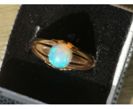 An opal set 9ct gold ring, a 9ct signet ring and one other. (3)