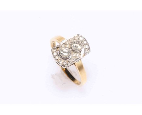 Diamond set 18 carat gold ring, having two stones with sixteen in a border, size R.