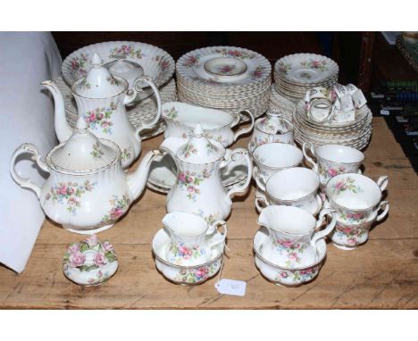 Royal Albert Moss Rose part tea and dinner service including teapots, gravy boat, napkin rings, approximately eighty pieces.