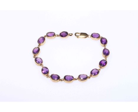 Amethyst and 9 carat gold bracelet having fourteen oval stones, 19cm length.