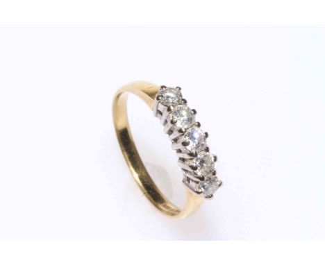 Five stone diamond ring set in 18 carat gold, size R.