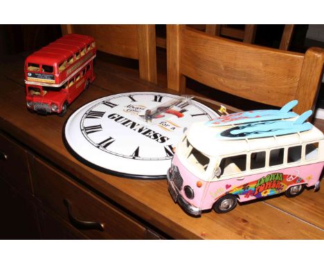 Reproduction Quartz clock and two reproduction model vehicles.