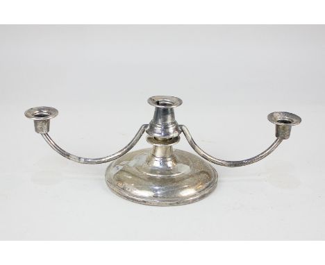 A modern silver small three-light candlestick on loaded circular base, marks rubbed, probably Birmingham 1980, width 18cm