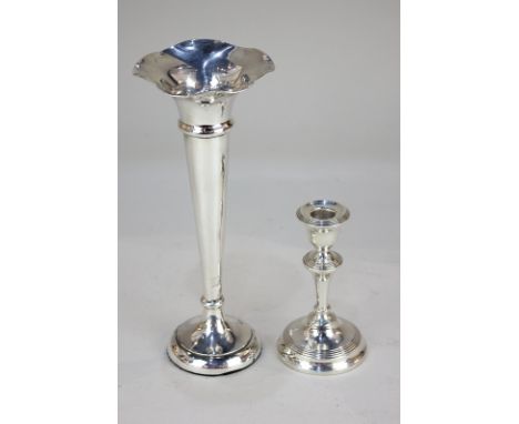 A George V silver bud vase, maker S Blanckensee & Son Ltd, Birmingham 1919, together with a silver candlestick, maker Herbert