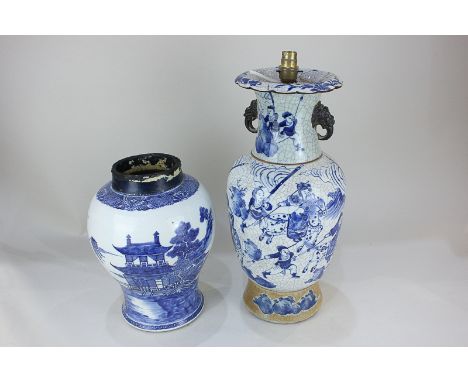 A Chinese blue and white crackle glaze baluster vase, now as a table lamp, depicting warriors training, with Fo dog lugs (a/f