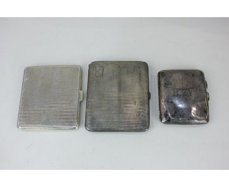 A George V silver cigarette case with engine turned decoration, Birmingham 1930, another similar and a smaller case with engr