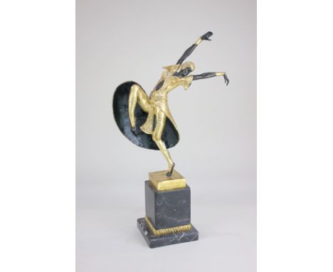 Manner of Demétre Chiparus, an Art Deco style gilt and bronze figure of a dancer, leg and arms outstretched, on black marble 