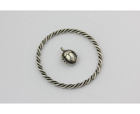 Georg Jensen, a silver acorn pendant, design 188; a silver rope twist bangle, design 17A