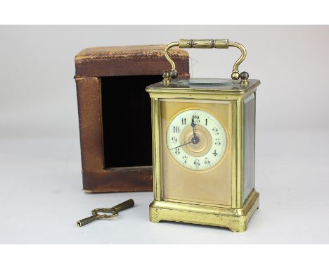 A 19th century brass cased carriage clock with Arabic enamelled chapter ring, leather case (a/f), 10.5cm high