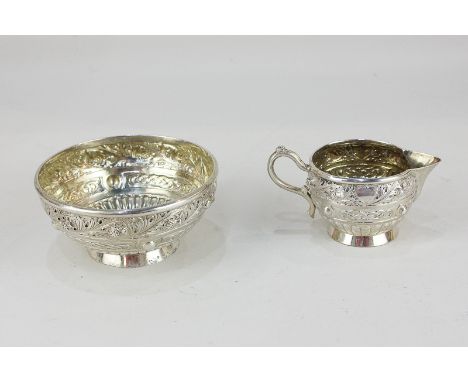 A Victorian Scottish silver cream jug and matching sugar bowl, maker James Rettie & Son, Edinburgh 1897, with embossed thistl